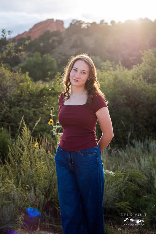 Senior portrait in warm evening light, photographed by Deus Volt Photography